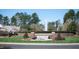Beautiful community entrance with well-maintained landscaping and water fountain at 2118 Cloud Cover Ln, Raleigh, NC 27614
