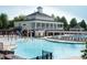 Resort-style pool with ample seating and splash pad in community clubhouse at 2118 Cloud Cover Ln, Raleigh, NC 27614