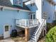 Exterior of home featuring a deck with outdoor access to a stone patio at 2118 Cloud Cover Ln, Raleigh, NC 27614
