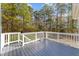 Spacious outdoor deck overlooking a serene wooded area, perfect for entertaining at 2118 Cloud Cover Ln, Raleigh, NC 27614