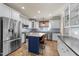 Gourmet kitchen with stainless steel appliances and large center island at 2118 Cloud Cover Ln, Raleigh, NC 27614