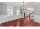 An empty living room featuring hardwood floors, white trim, and natural light at 2118 Cloud Cover Ln, Raleigh, NC 27614