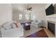 Bright living room features hardwood floors, fireplace, and ample seating at 2118 Cloud Cover Ln, Raleigh, NC 27614