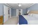 Spacious main bedroom with tray ceilings, fan, and two walk-in closets at 2118 Cloud Cover Ln, Raleigh, NC 27614
