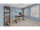 Comfortable office with natural light, blue walls, and functional desk space at 2118 Cloud Cover Ln, Raleigh, NC 27614