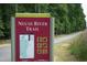 A view of the Neuse River Trail sign with map and rules posted, near the greenway at 2118 Cloud Cover Ln, Raleigh, NC 27614
