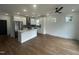 Bright kitchen with stainless appliances, a center island, and sleek hardwood floors at 2214 Woodrow St, Durham, NC 27705