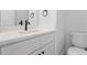 Modern bathroom features a sleek vanity with black hardware and faucet at 2218 Woodrow St, Durham, NC 27705