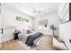 Serene bedroom with hardwood floors, neutral tones, ample natural light, and modern decor at 2218 Woodrow St, Durham, NC 27705
