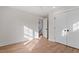 Clean bedroom with hardwood floors, a ceiling fan and large closet at 2218 Woodrow St, Durham, NC 27705