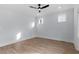 Bright bedroom with hardwood floors, ceiling fan, and plenty of natural light at 2218 Woodrow St, Durham, NC 27705