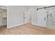 Bright bedroom with hardwood floors and en suite bathroom at 2218 Woodrow St, Durham, NC 27705
