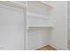 Walk in closet with wooden racks at 2218 Woodrow St, Durham, NC 27705
