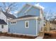 Blue two story home with a dark roof and white trim, viewed from the side at 2218 Woodrow St, Durham, NC 27705