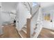 Staircase with natural wood and white trim detail at 2218 Woodrow St, Durham, NC 27705