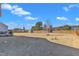 Spacious fenced backyard with a well-maintained lawn and a storage shed, offering privacy and room for recreation at 2220 Stillness Pond Ln, Apex, NC 27539