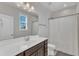 Simple bathroom with a single vanity and combination shower and tub at 2220 Stillness Pond Ln, Apex, NC 27539