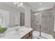 Updated bathroom features a glass-enclosed shower and a modern vanity at 2220 Stillness Pond Ln, Apex, NC 27539