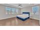 Bright bedroom featuring a tray ceiling, ceiling fan and plenty of natural light at 2220 Stillness Pond Ln, Apex, NC 27539