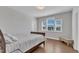 Bright bedroom with natural light, hardwood floors and a comfortable bed at 2220 Stillness Pond Ln, Apex, NC 27539