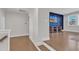 Cozy bonus room features a large window and stylish blue accent wall at 2220 Stillness Pond Ln, Apex, NC 27539