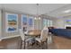 Dining Room with wood table and seating, windows and view of living room at 2220 Stillness Pond Ln, Apex, NC 27539