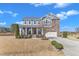 Charming two-story home featuring a landscaped yard, covered front porch, and attached two-car garage at 2220 Stillness Pond Ln, Apex, NC 27539