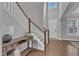 Bright foyer with staircase, hardwood floors, and natural light at 2220 Stillness Pond Ln, Apex, NC 27539