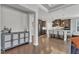 Open kitchen with stainless appliances, granite counters and island seating at 2220 Stillness Pond Ln, Apex, NC 27539