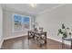 Bright office space with hardwood floors, a large window and crown molding at 2220 Stillness Pond Ln, Apex, NC 27539