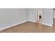 An empty room with hardwood floors and a doorway on the right at 2220 Stillness Pond Ln, Apex, NC 27539