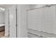 A shower with white and gray striped shower curtain, with a partially viewed room on the left at 2220 Stillness Pond Ln, Apex, NC 27539