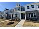 Charming townhome with stone accents, well-manicured lawn, and welcoming entrance at 2353 Whitewing Ln, Wendell, NC 27591