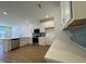 Modern kitchen featuring stainless steel appliances, white cabinets, and granite countertops at 2353 Whitewing Ln, Wendell, NC 27591