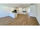 Spacious open-concept living area with wood flooring and plenty of natural light at 2353 Whitewing Ln, Wendell, NC 27591