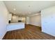 Bright, open-concept living space with modern finishes and beautiful wood flooring at 2353 Whitewing Ln, Wendell, NC 27591