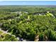 Sprawling property features mature trees, lush landscaping and neighboring lake, providing a private retreat at 266 Perfect Moment Dr, Durham, NC 27713