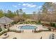 Expansive aerial view of the backyard pool, play area, and landscaped grounds at 266 Perfect Moment Dr, Durham, NC 27713