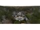 Opulent home boasting a pool, covered patio, and a manicured lawn amidst lush greenery, creating a serene retreat at 266 Perfect Moment Dr, Durham, NC 27713