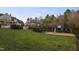 Spacious backyard featuring a lush lawn, a charming gazebo, and a fun playground, perfect for outdoor activities and relaxation at 266 Perfect Moment Dr, Durham, NC 27713