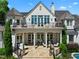 Elegant home featuring a sprawling backyard with a covered patio and lush greenery perfect for relaxation at 266 Perfect Moment Dr, Durham, NC 27713