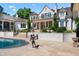 Expansive backyard with a pool, patio, and lush landscaping, perfect for outdoor entertaining at 266 Perfect Moment Dr, Durham, NC 27713