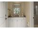 Elegant bathroom vanity with granite countertop and decorative mirror at 266 Perfect Moment Dr, Durham, NC 27713