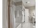 Bright bathroom features a tiled shower, tub, and neutral decor at 266 Perfect Moment Dr, Durham, NC 27713