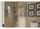 Tiled shower with glass door and adjacent toilet with framed artwork at 266 Perfect Moment Dr, Durham, NC 27713