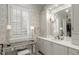 Bright bathroom features a vanity area, stylish mirror, and classic design elements at 266 Perfect Moment Dr, Durham, NC 27713