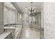 Elegant bathroom with a tub, glass shower, decorative wallpaper, and custom vanity at 266 Perfect Moment Dr, Durham, NC 27713