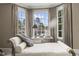 Bright bay window seating area featuring elegant decor, chaise lounge, and a scenic view at 266 Perfect Moment Dr, Durham, NC 27713