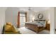 Cozy bedroom offers comfortable bed, ceiling fan, and ample natural light at 266 Perfect Moment Dr, Durham, NC 27713