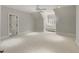 Spacious bedroom with plush carpeting, ceiling fan, and ample natural light at 266 Perfect Moment Dr, Durham, NC 27713